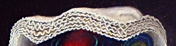 Close-up of Margaret the Netherlandish Alien's headdress showing the six layers of cloth where you can see in between the layers when you look at those layers that are end-on. Copyright (c)2020 Paul Alan Grosse