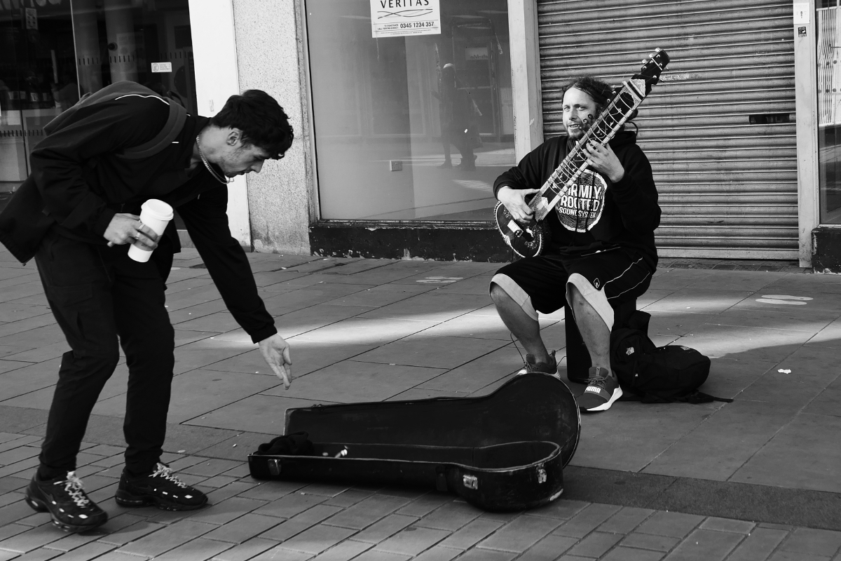 Derby: City centre busker with a sitar 20221015 Copyright (c)2022 Paul Alan Grosse. All Rights Reserved.