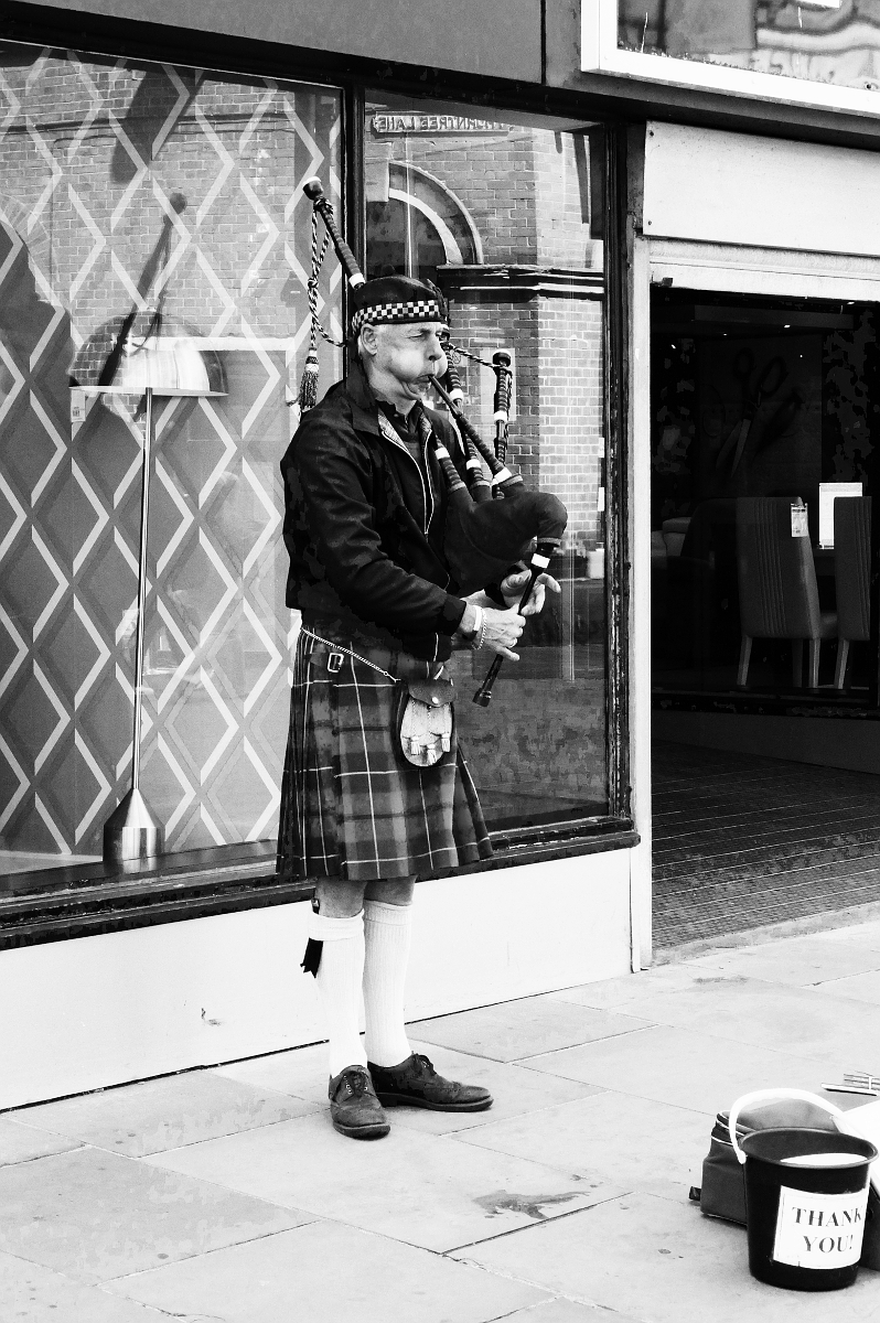 Derby: Busker - Bagpipes. Photograph Copyright (c)2023 Paul Alan Grosse. All Rights Reserved.