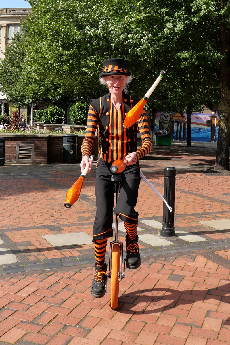 Derby: Carnival Unicyclist. Photograph Copyright (c)2023 Paul Alan Grosse. All Rights Reserved.