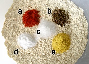 a) chilli powder; b) ajwain seeds; c) salt; d) sodium bicarbonate; and e) asafoetida.
