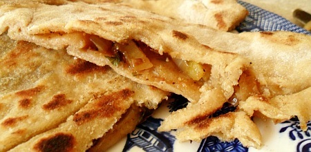 Two-piece stuffer paratha, hot and crispy, ready to eat.